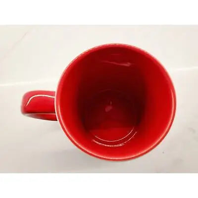 Red ceramic coffee mug featuring a unique polka dot Atlanta Falcons logo design