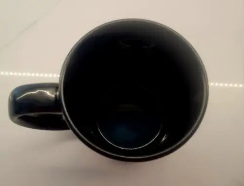 Dark ceramic mug featuring Cincinnati Bengals design, perfect for game day celebrations