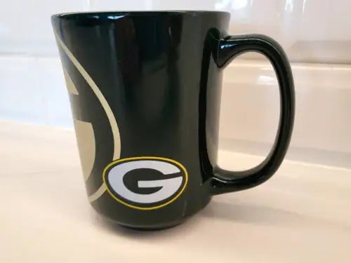 Green Bay Packers ceramic coffee mug featuring Green Bay logo for NFL fans
