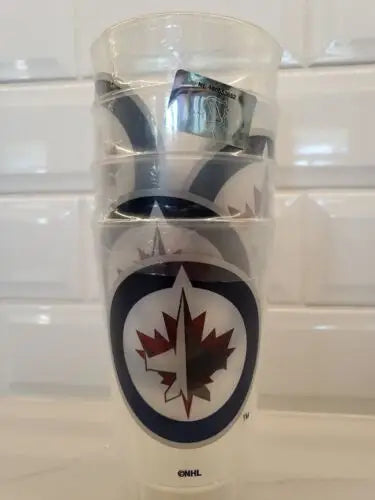 Stack of Winnipeg Jets cups next to Toronto Maple Leafs Plastic Logo’d Cups