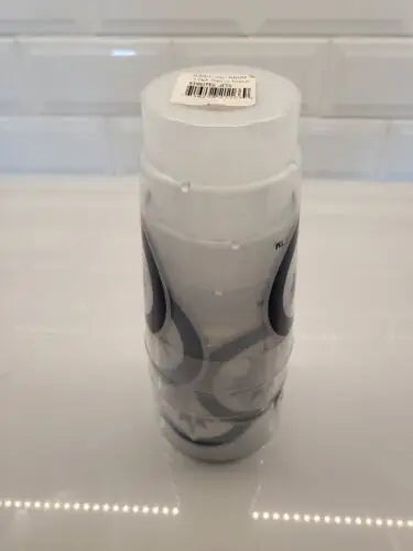 White candle with black teardrop design matching Toronto Maple Leafs themed decor
