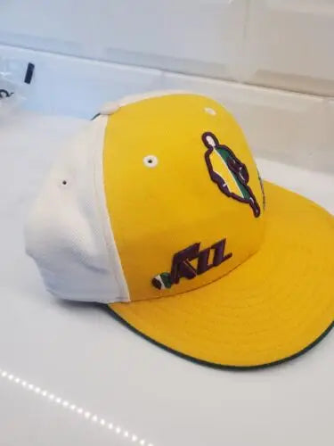 Yellow and white Utah Jazz baseball cap from the Orleans Jazz 1970s Authentic collection