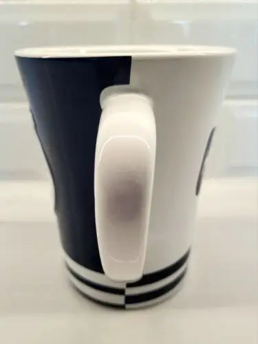 Two-toned ceramic coffee mug featuring Baltimore Colts logo by Boelter Brands