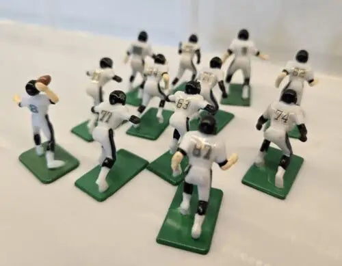 Miniature Jacksonville Jaguars electronic football players with QB and ball for NFL Tudor 12