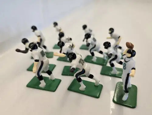 Miniature Jacksonville Jaguars electronic football players with quarterback and ball for display