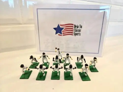 Miniature Jacksonville Jaguars electronic football players with QB and ball for electronic football games