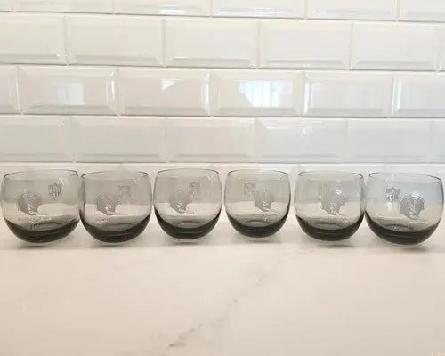 Six gray smokey rolly polly glasses with squirrel designs featuring vintage Atlanta Falcons logo