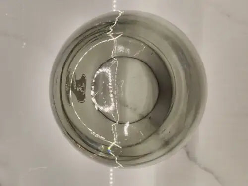 Round glass vase with a crack, part of vintage Atlanta Falcons smokey Rolly Polly set