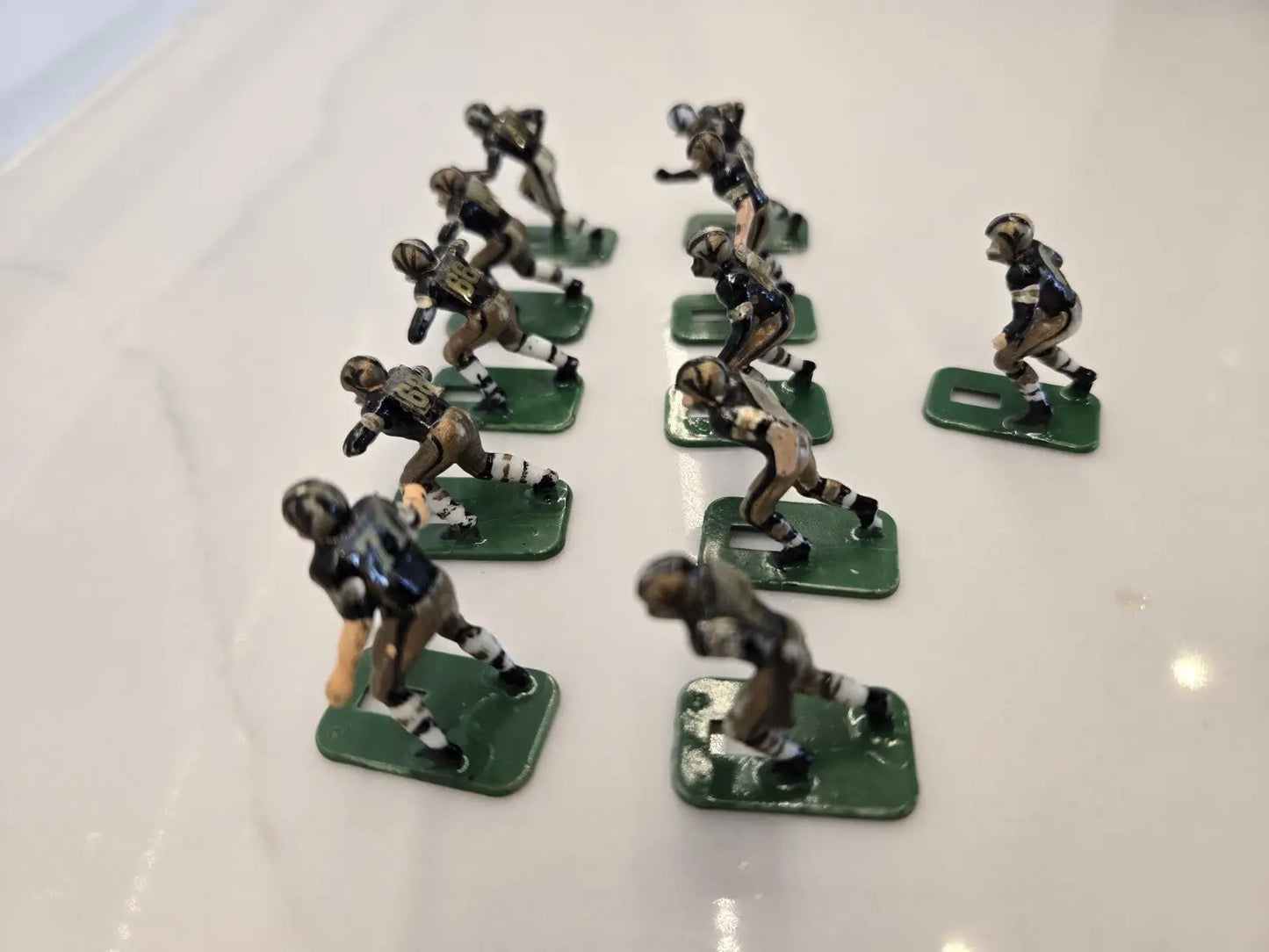 Vintage metal football figurines from the Orleans Saints Electronic player set