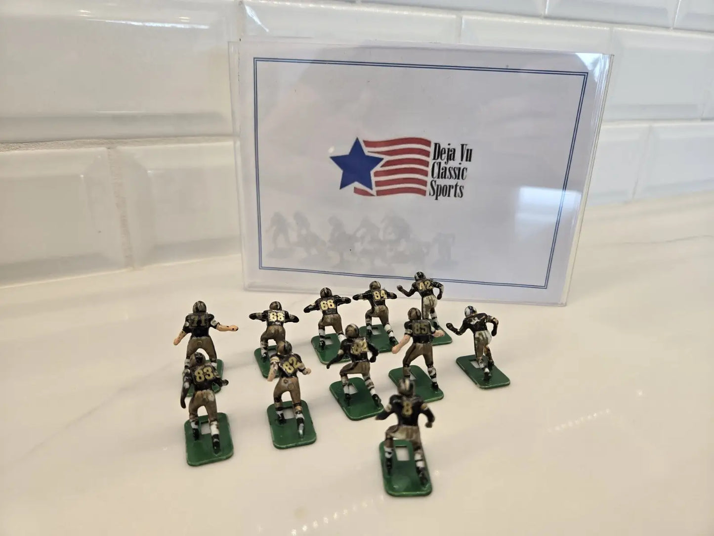 Miniature football player figurines from NFL Orleans Saints Electronic Player Set