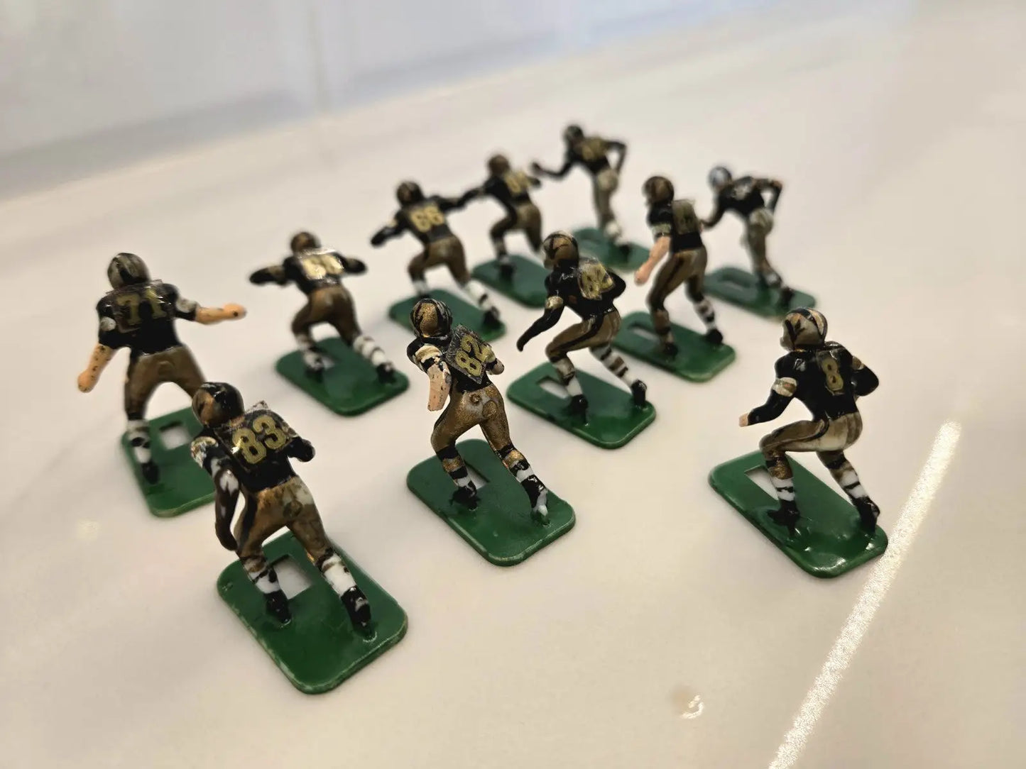 Miniature football player figurines from the Orleans Saints electronic set