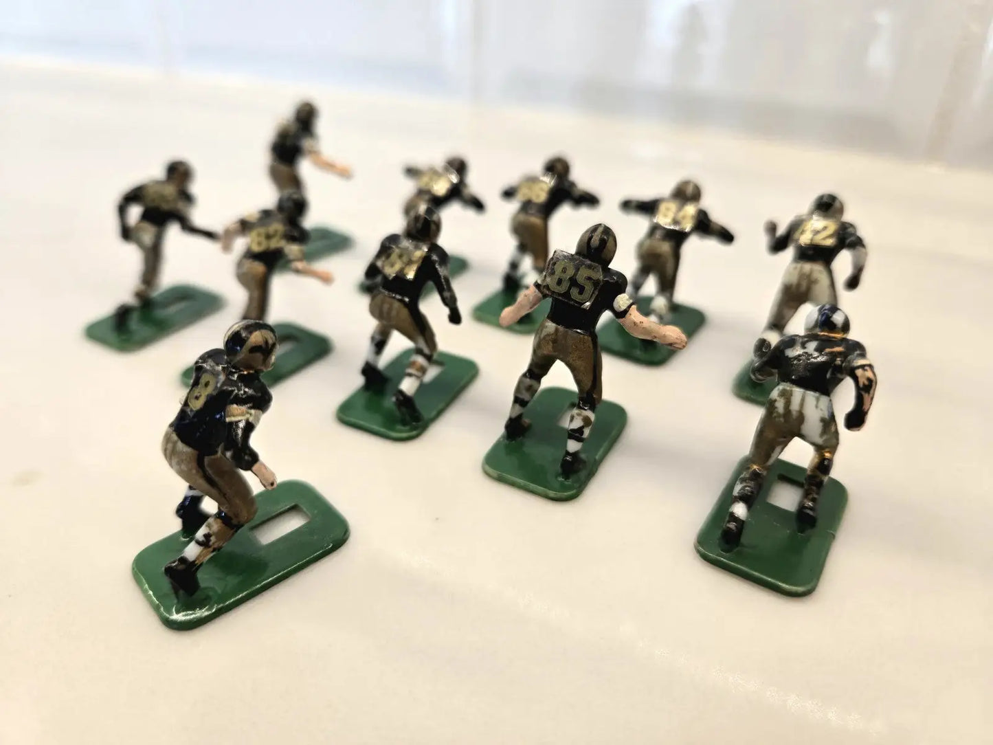 Miniature football player figurines from the Orleans Saints Electronic set by Tudor