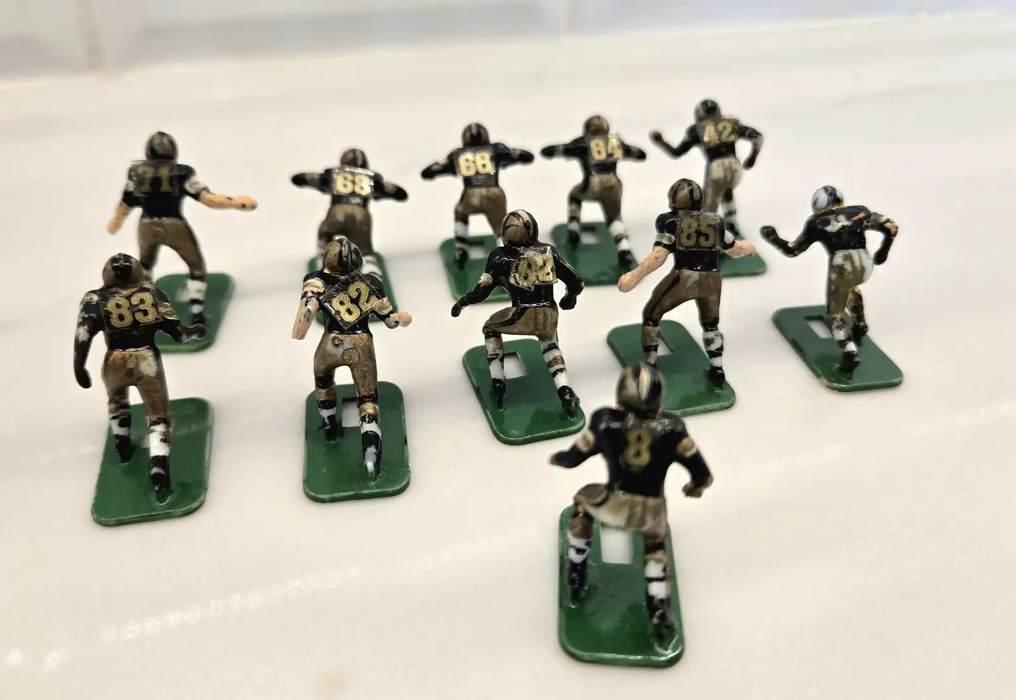 Miniature football team figures from Orleans Saints Electronic Player Set by Tudor