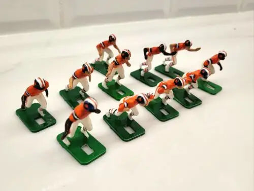 Vintage football toy figures from the Denver Broncos Electronic Football set from the 1970s