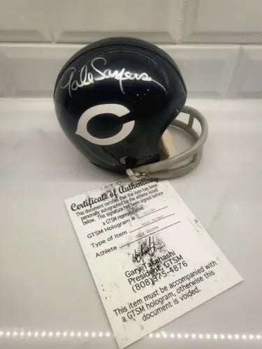 Signed Gale Sayers Chicago Bears Mini-Helmet with Certificate of Authenticity displayed