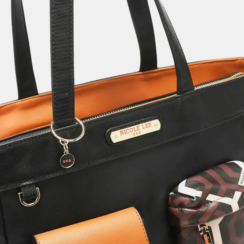 Black and orange Nicole Lee tote bag with vegan leather accents and zip compartments
