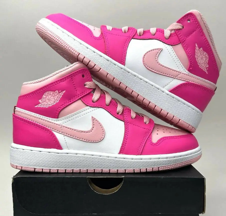 Vibrant pink and white Nike Air Jordan 1 Mid sneakers for fast shipping business days