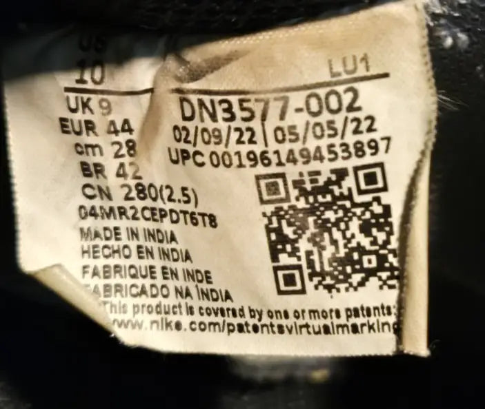 Nike Court Vision Mid black and white sneakers label with sizing, dates, code, UPC, QR