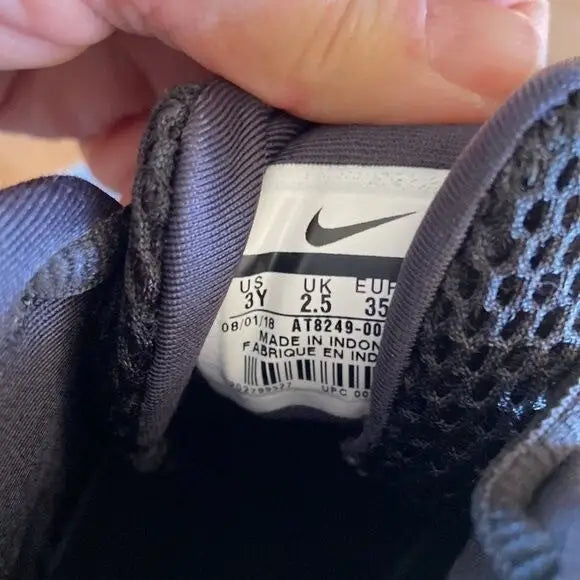 Close-up of Nike Girls High Top Shoes Size 3Y black floral inner label with size details