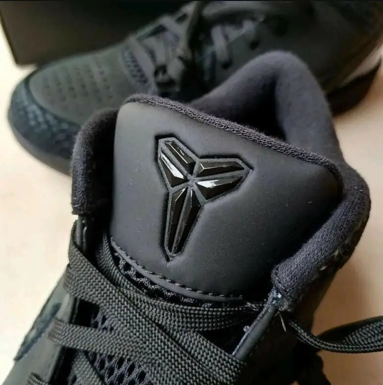 Black Nike Kobe 4 Protro athletic shoe with Kobe Bryant Sheath logo, fast shipping available