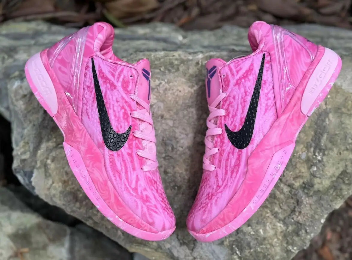 Vibrant pink Nike Kobe 6 Strawberry Milk sneakers with black swoosh and purple accents, fast shipping available