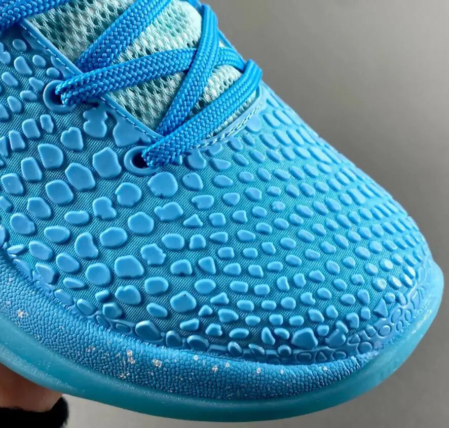 Bright blue Nike Kobe Zoom 6 Protro Ice Grinch athletic shoe with textured pebbled upper