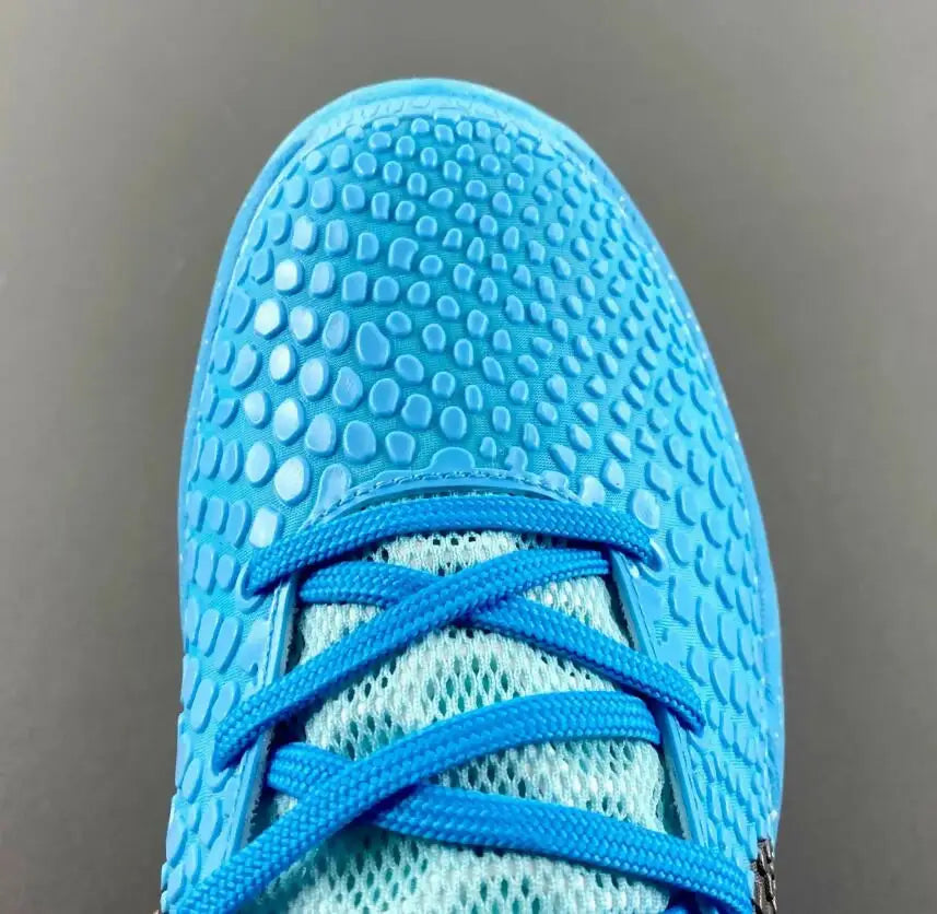Close-up of Nike Kobe Zoom 6 Protro Ice Grinch athletic shoe toe box with fast shipping