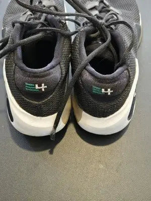 Nike Zoom Freak 1 basketball shoes with black, white, and green accents for athletes