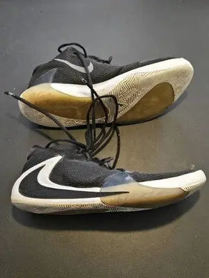 Nike Zoom Freak basketball shoes in black and white with tan soles, size 11