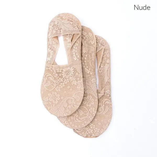 Three pairs of nude floral lace sneaker socks in a No-Slip Floral Lace Sneaker Socks 3 Pack