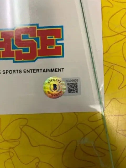 Beckett authentication sticker on Nolan Ryan HSE 1990 autographed poster