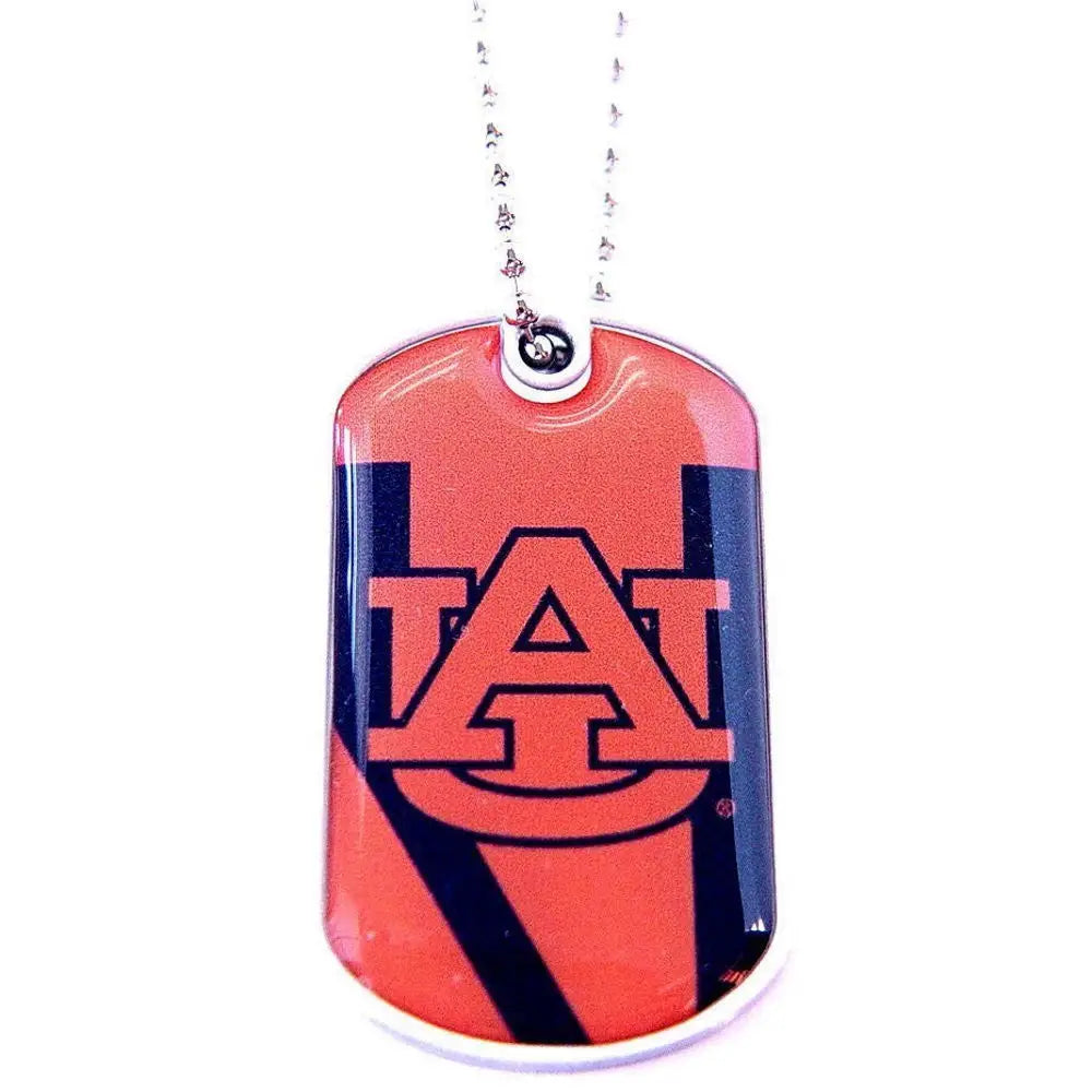 Dog tag-style pendant with Auburn University AU logo in navy on orange for licensed NCAA team