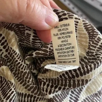 Fabric label with material and care details on Old Navy Brown Quilted Tote Bag