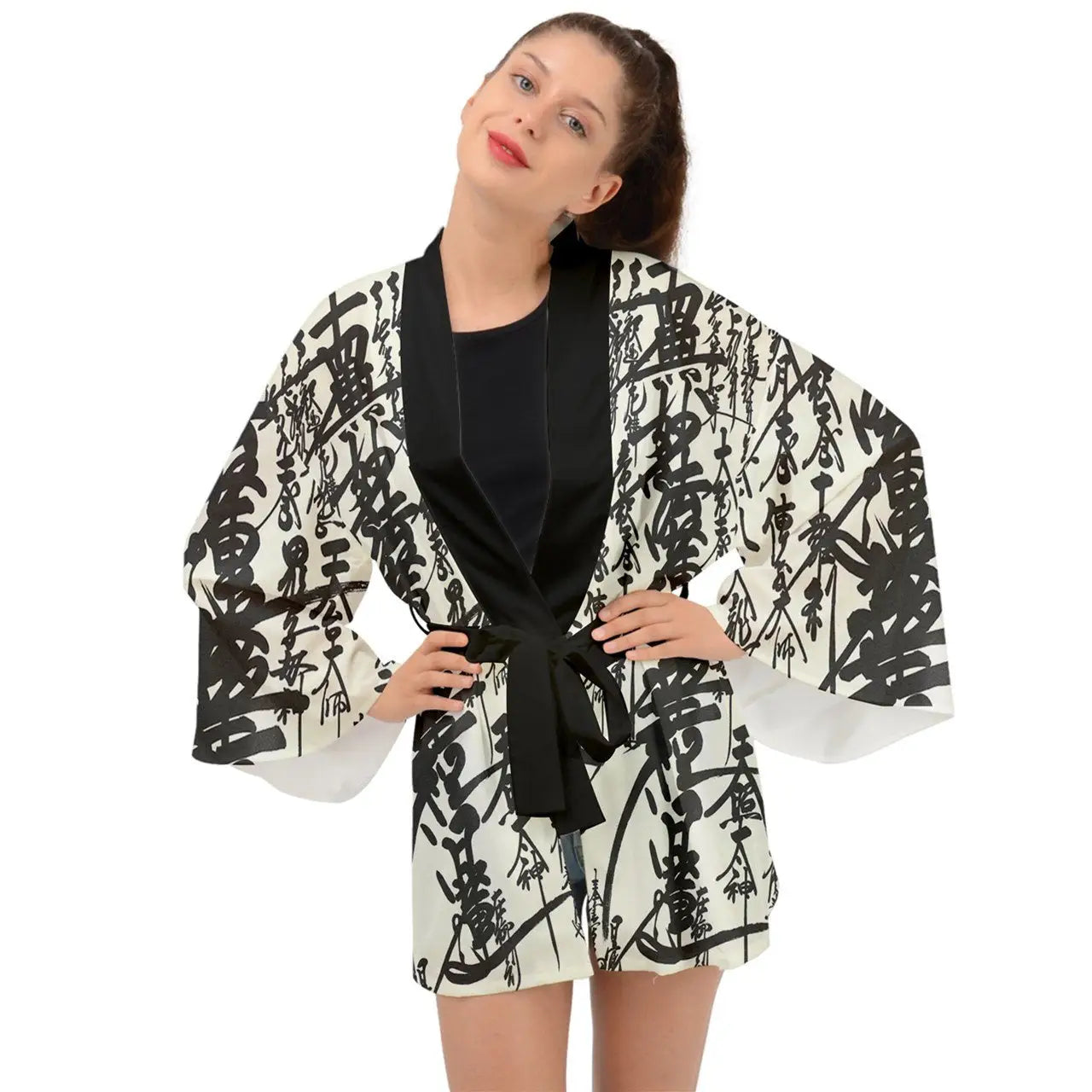 Woman modeling a black and white oriental design long sleeve kimono robe with tie waist