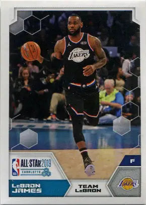 Basketball player in Lakers jersey dribbling ball on Panini sticker card