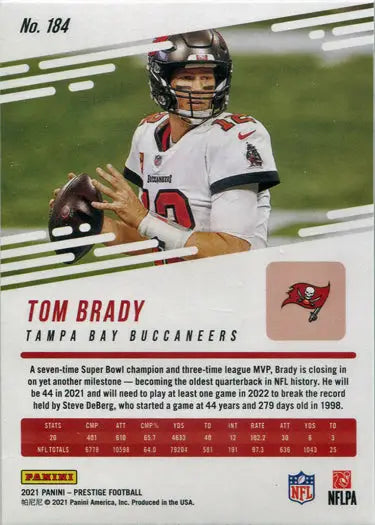 Football player in a white jersey holding a football on Panini Prestige Base Card 184