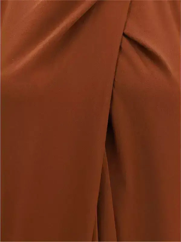 Close-up of rust-colored Petar Petrov Henna Silk Dress fabric with central seam
