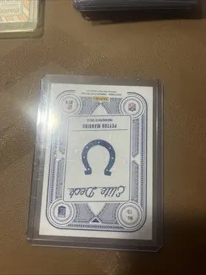 Peyton Manning 2025 Elite Deck collectible trading card in clear protective holder