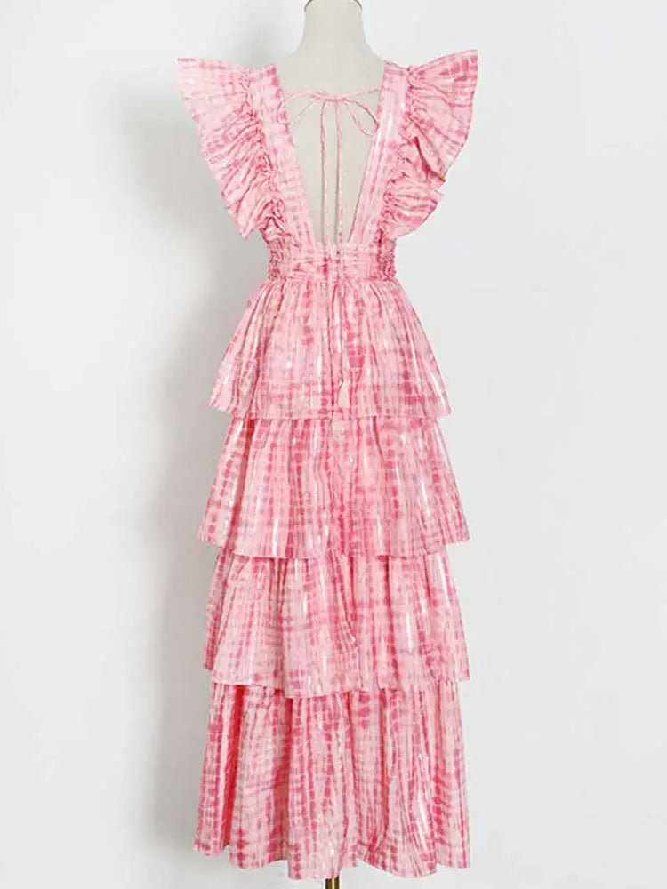Pink deep v neckline long dress with ruffle sleeves and tiered design perfect for summer