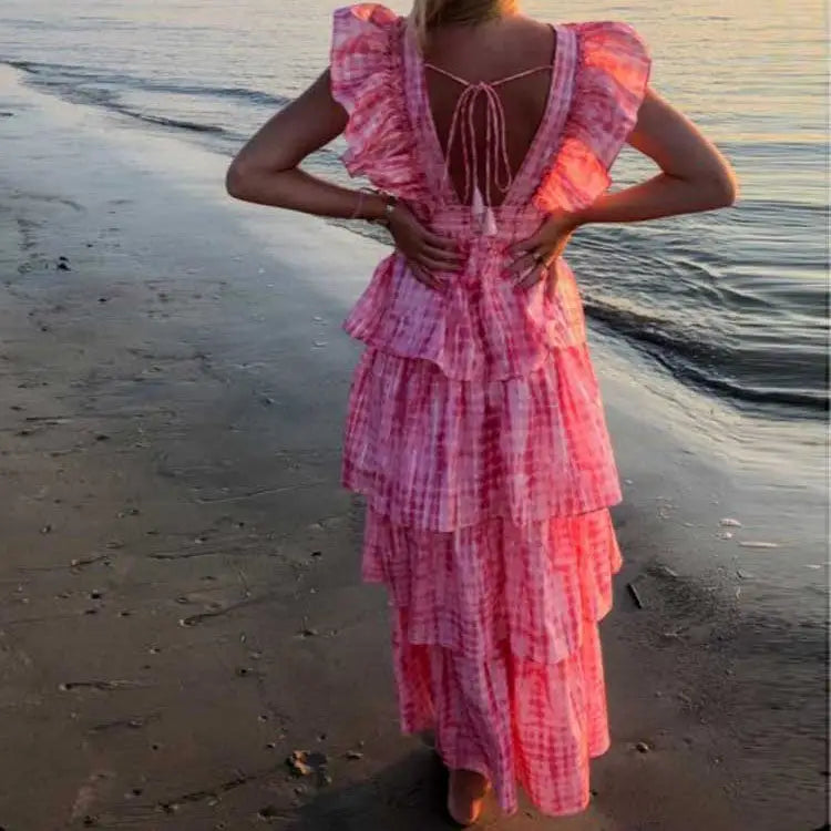 Pink deep v neckline long dress with tiered ruffles and tie-back detail for summer style