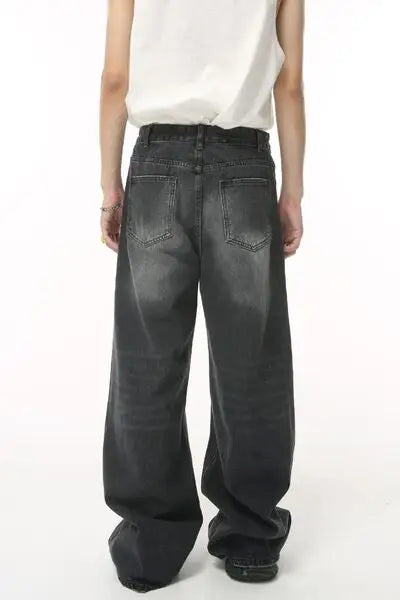 Loose-fitting faded black denim jeans with visible back pockets from Pocketed Wide Leg Jeans