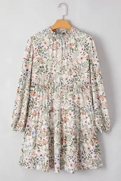 White floral print tiered smock dress with a printed mock neck and long sleeves