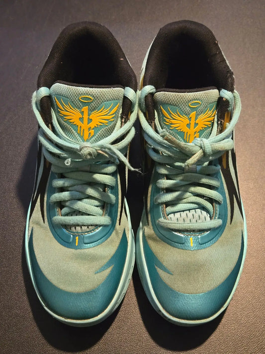 Light blue and grey Puma Basketball Shoes Men’s 7 with aqua teal accents and yellow logo