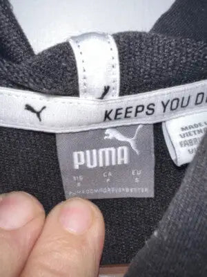 Black Puma Women’s Hoodie with white internal neck label displaying branding and size