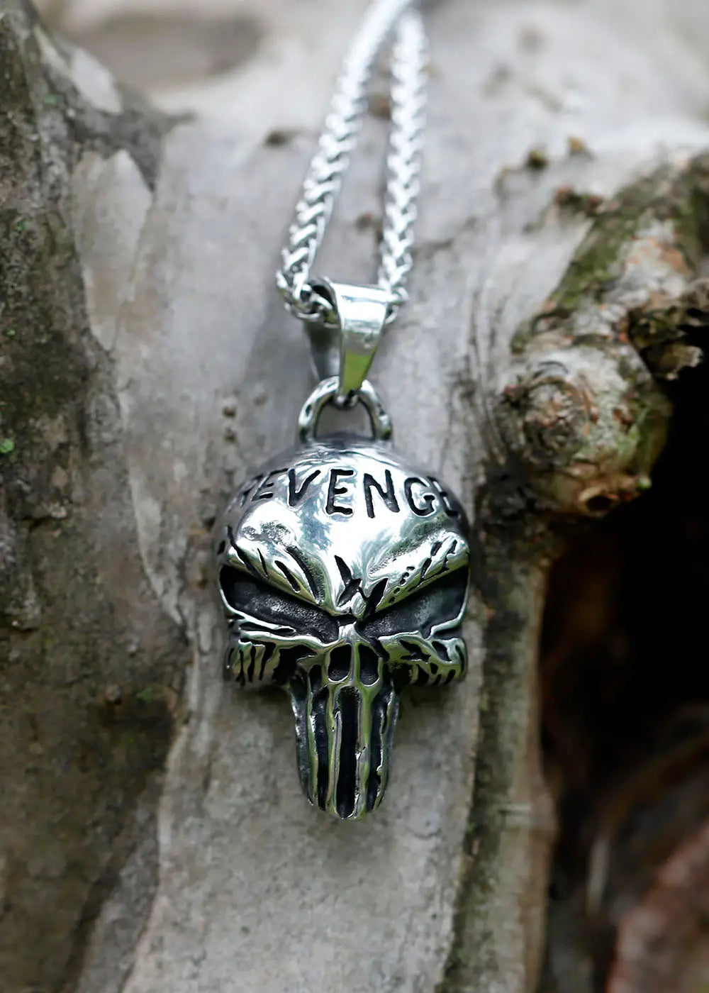 Silver skull pendant with REVENG inscribed, part of Punisher Revenge Necklace collection