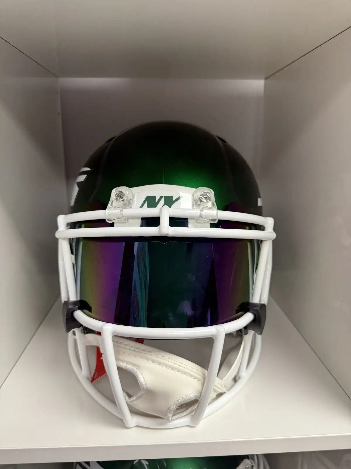 Green New York Jets football helmet with authentic autographed Quincy Williams signature