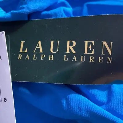 Blue fabric with LAUREN RALPH LAUREN tag on Ralph Lauren women’s one piece swimsuit