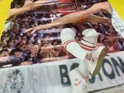 Glossy vintage Converse poster of Chicago Bulls player in red and white uniform mid-air