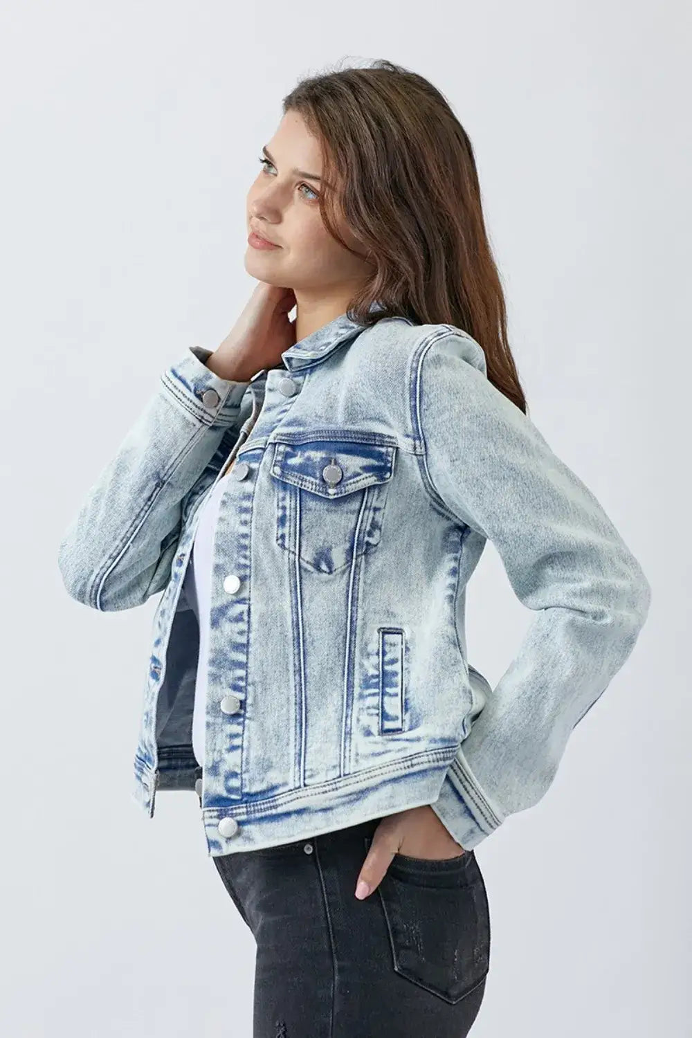 Light blue washed denim jacket with chest pockets and silver buttons from RISEN