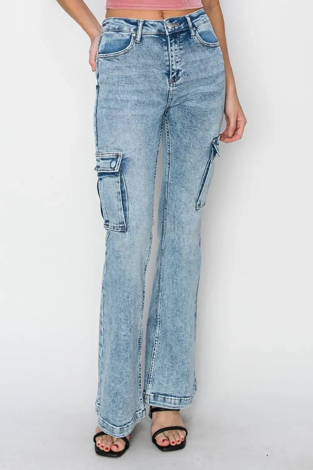 Light blue acid-wash cargo flare jeans with sandals from RISEN Full Size High Rise collection